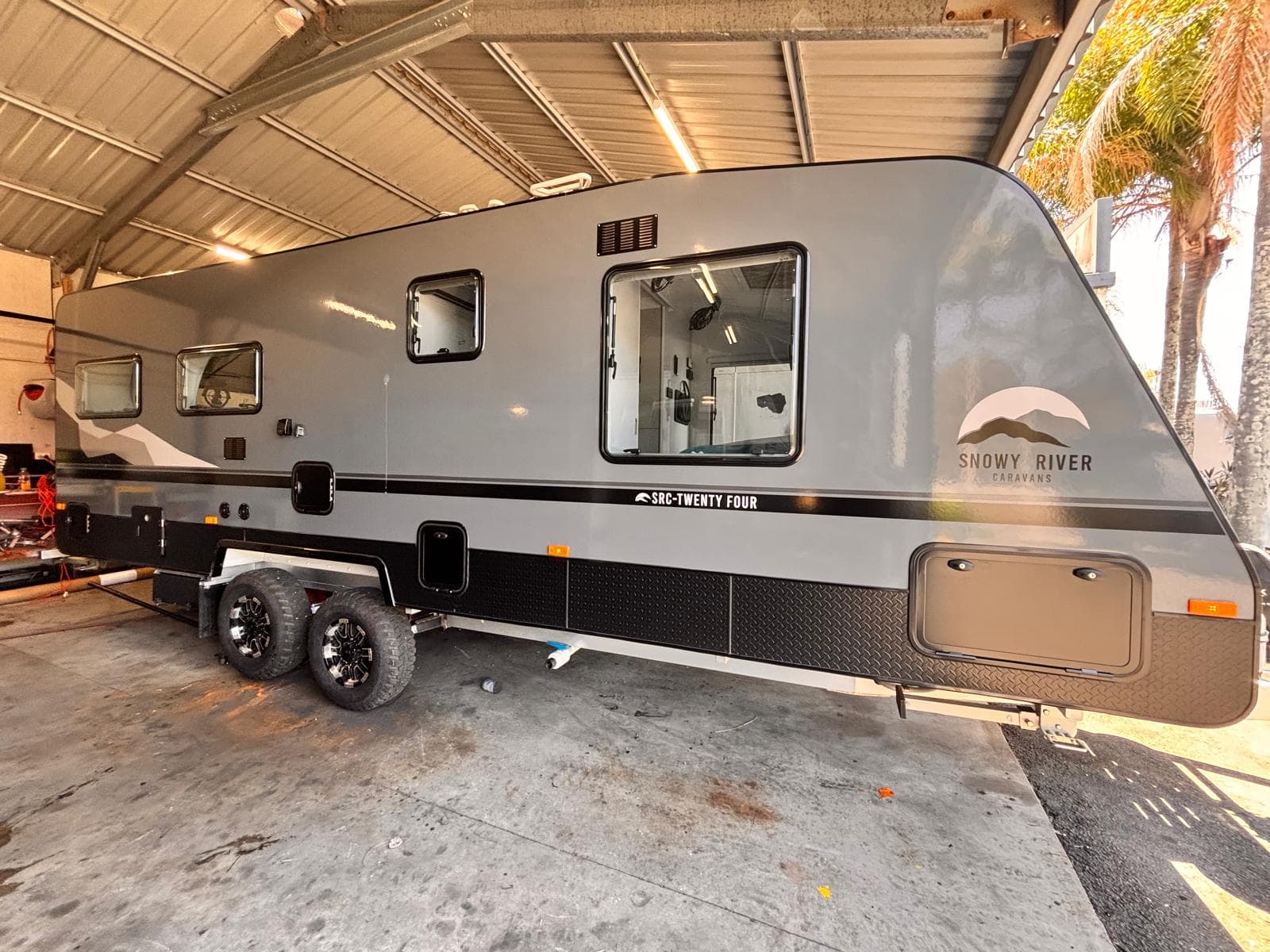 A caravan undergoing a mobile LPG gas safety inspection for compliance certification