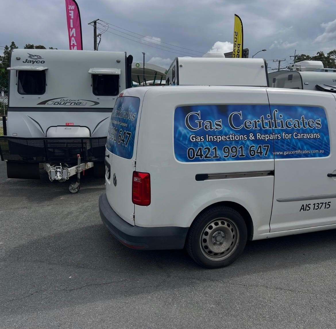 Gas Certificates mobile service van parked on site next to a caravan for a gas inspection